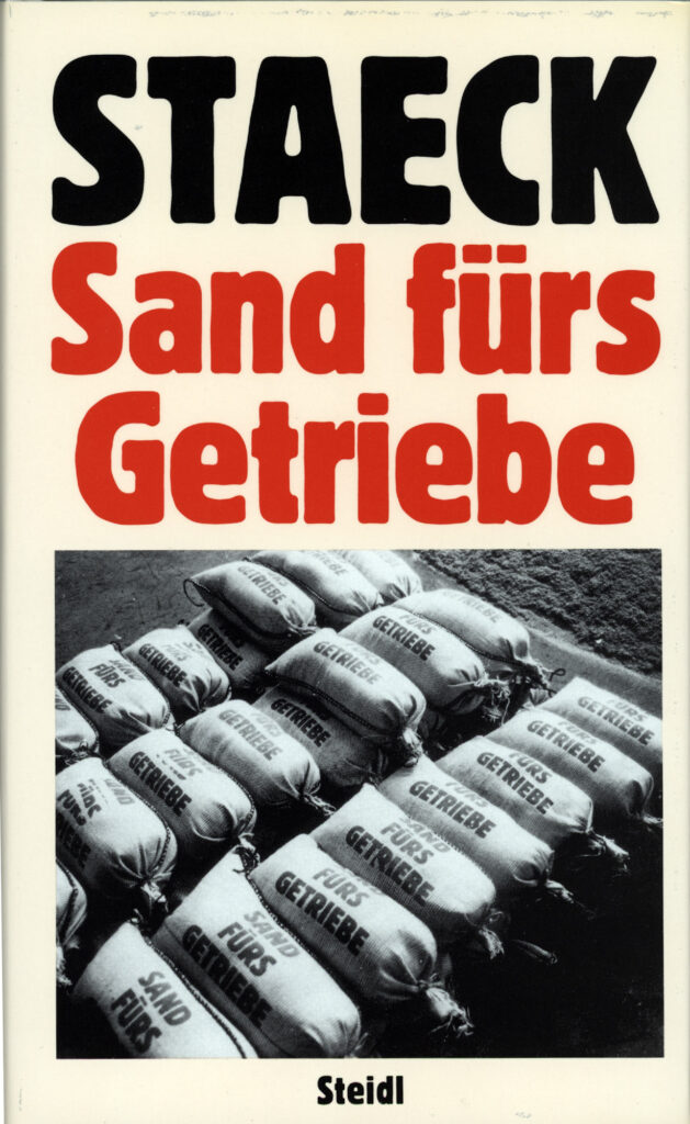 <span class="product-meta">Buch, 1989</span> <br /><span class="product-artist">Klaus Staeck</span><span class="breadcrumb-separator">: </span> <br />Sand fürs Getriebe